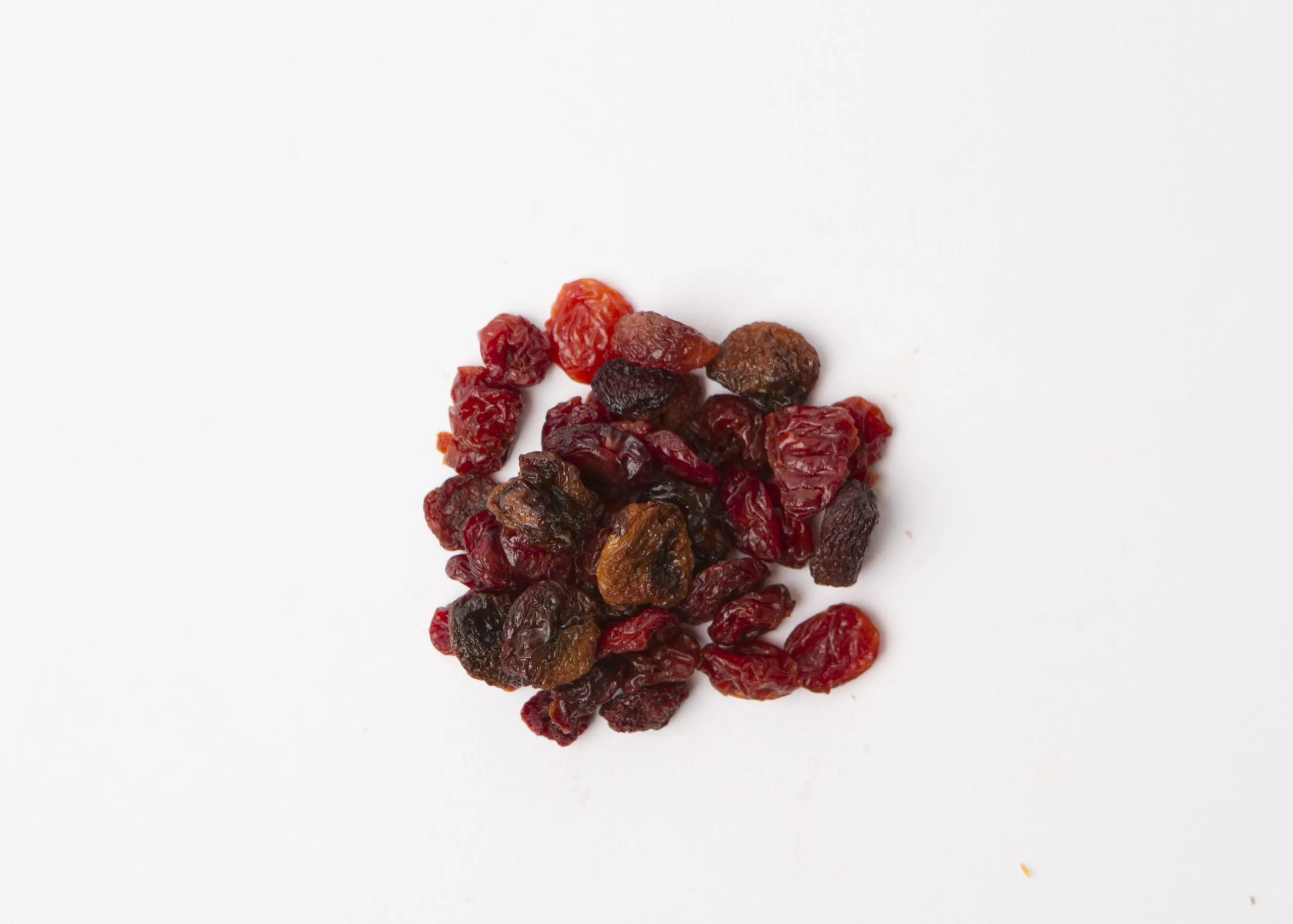 Traina® Three Cherry, Blend - small pile of sun dried fruit on white background.