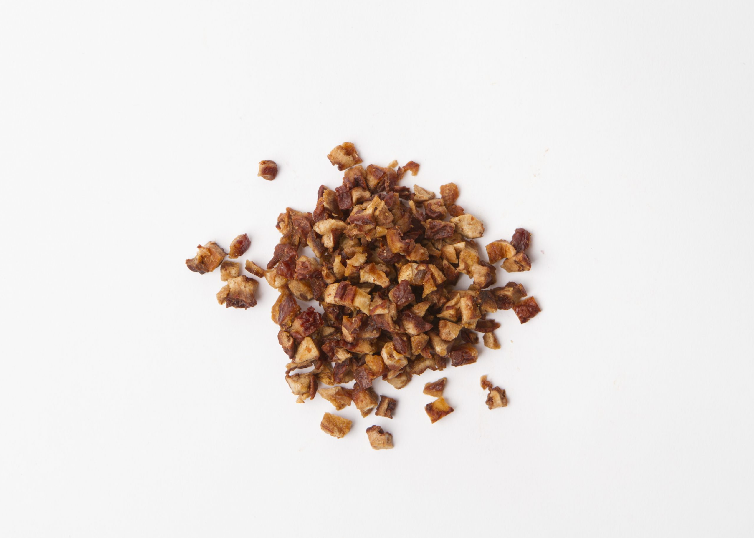 Traina® Natural Dried Pears, double-diced - small pile of sun dried fruit on white background.