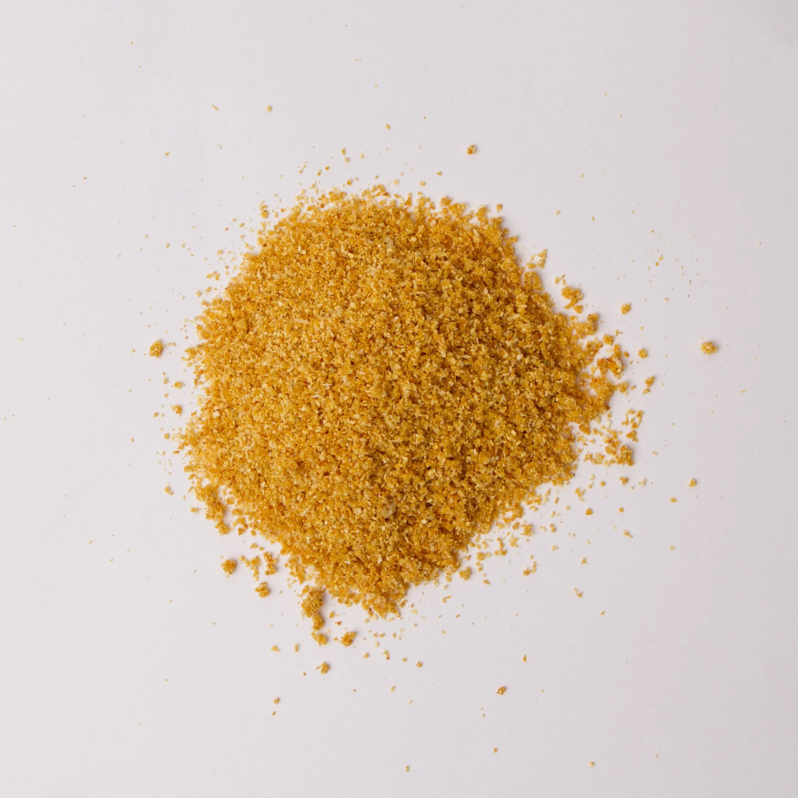 Traina® Natural Dried Tangerine, powder - small pile of dehydrated fruit on white background