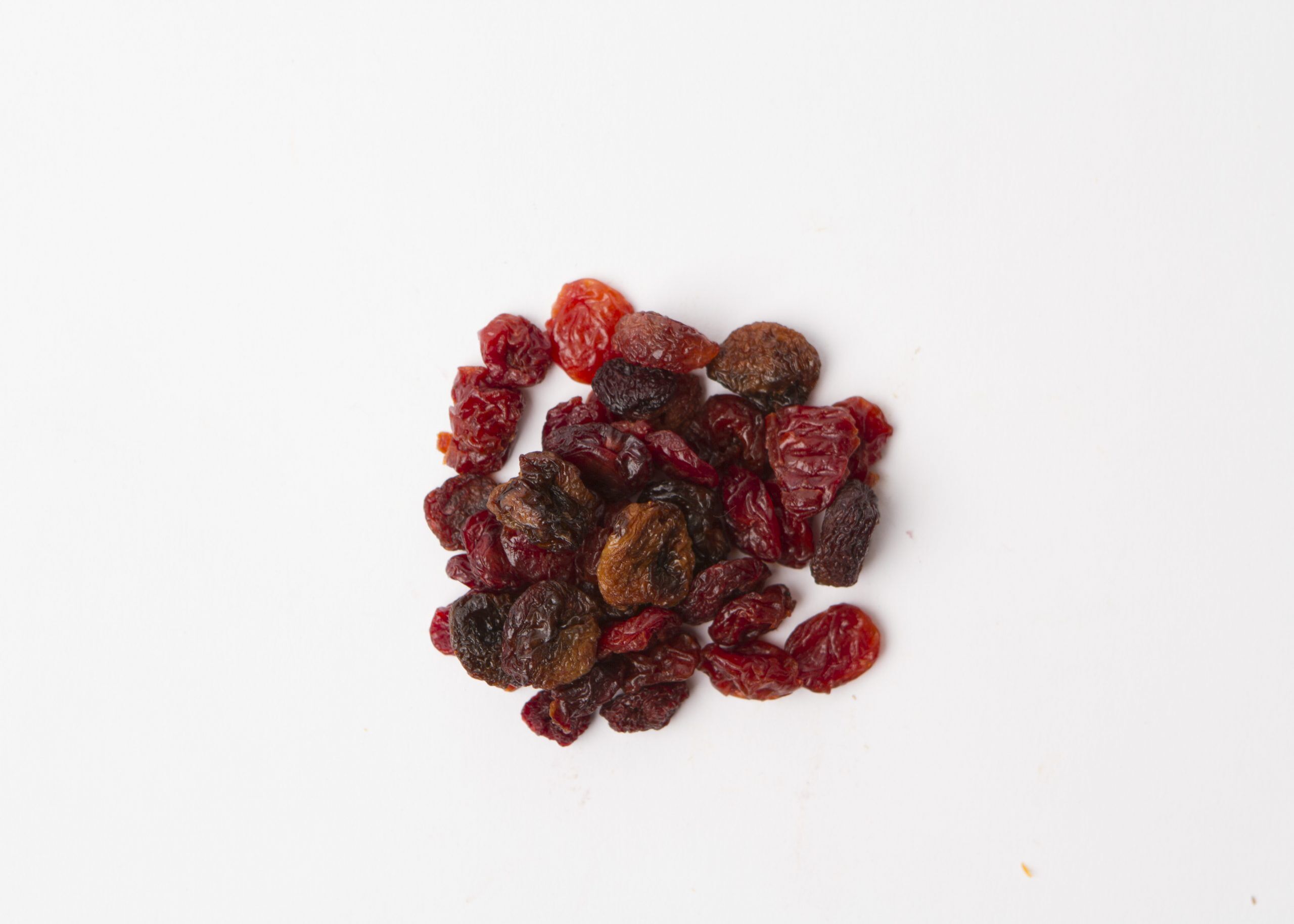 Traina® Three Cherry, Blend - small pile of sun dried fruit on white background.