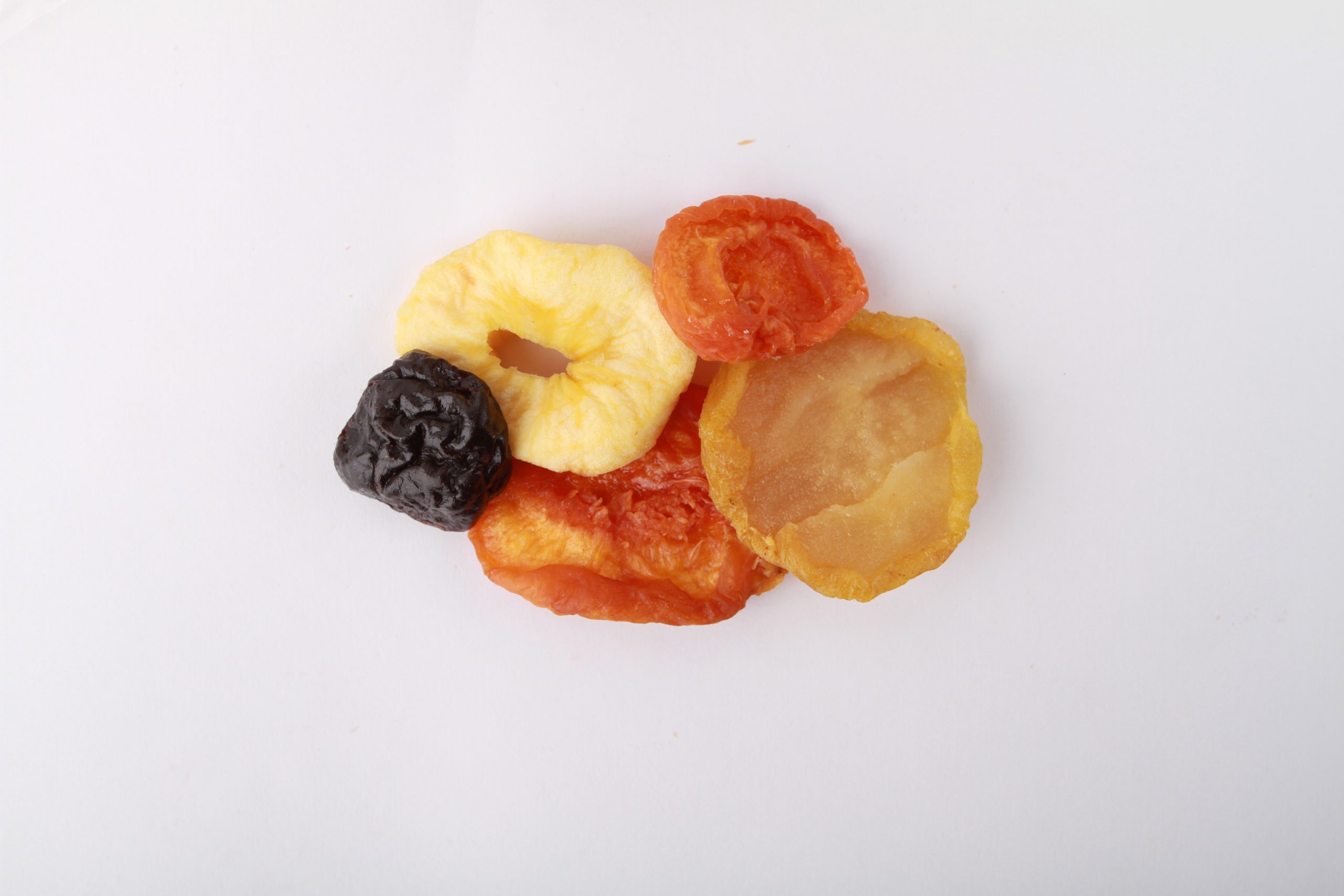 Traina® California Extra Fancy Mixed Fruit Blend - a small pile of dried fruit on white background.