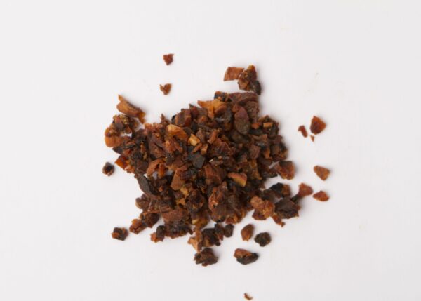 Traina® Natural California Sun Dried Apricots, double-diced - small pile of sun dried fruit on white background.