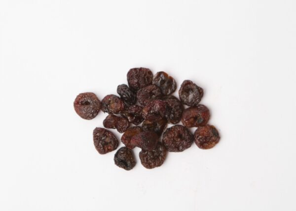 Traina® Natural California Sun Dried Rainier Cherries, pitted, whole - small pile of sun dried fruit on white background.