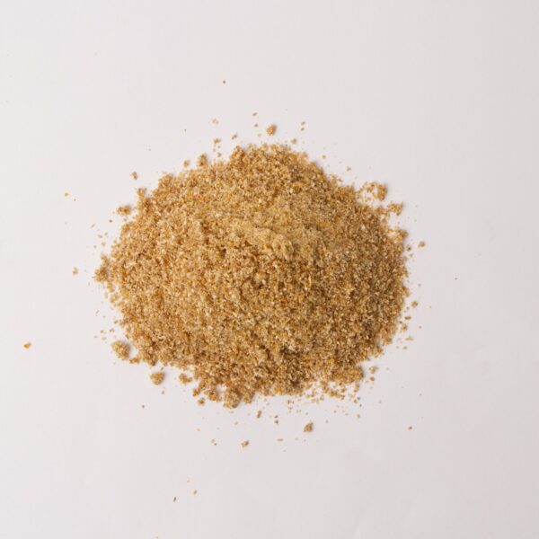 Traina® Natural Dried Lemon, powder - small pile of dried fruit on white background.