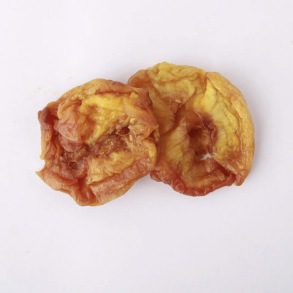 Traina® California Sun Dried Nectarines, Varigrade, halves - small pile of sun dried fruit on white background.