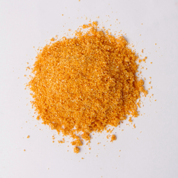 Traina® Organic Dried Orange, powder - small pile of dehydrated fruit on white background